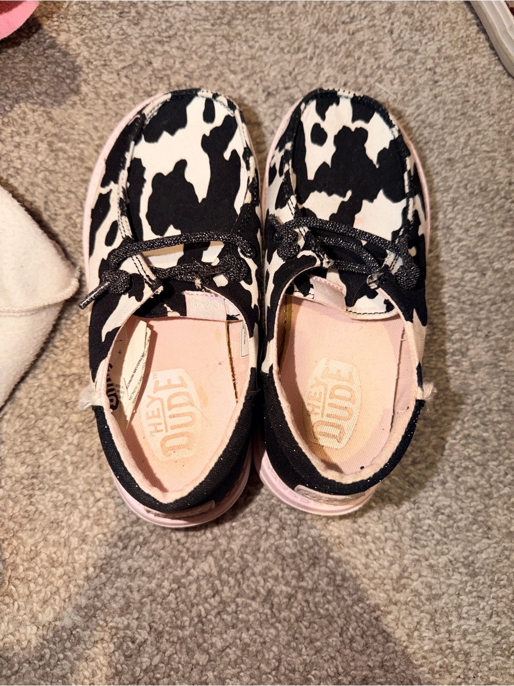 Hey Dude Kids Slip-On Sneakers in Black and Pink Cow Print